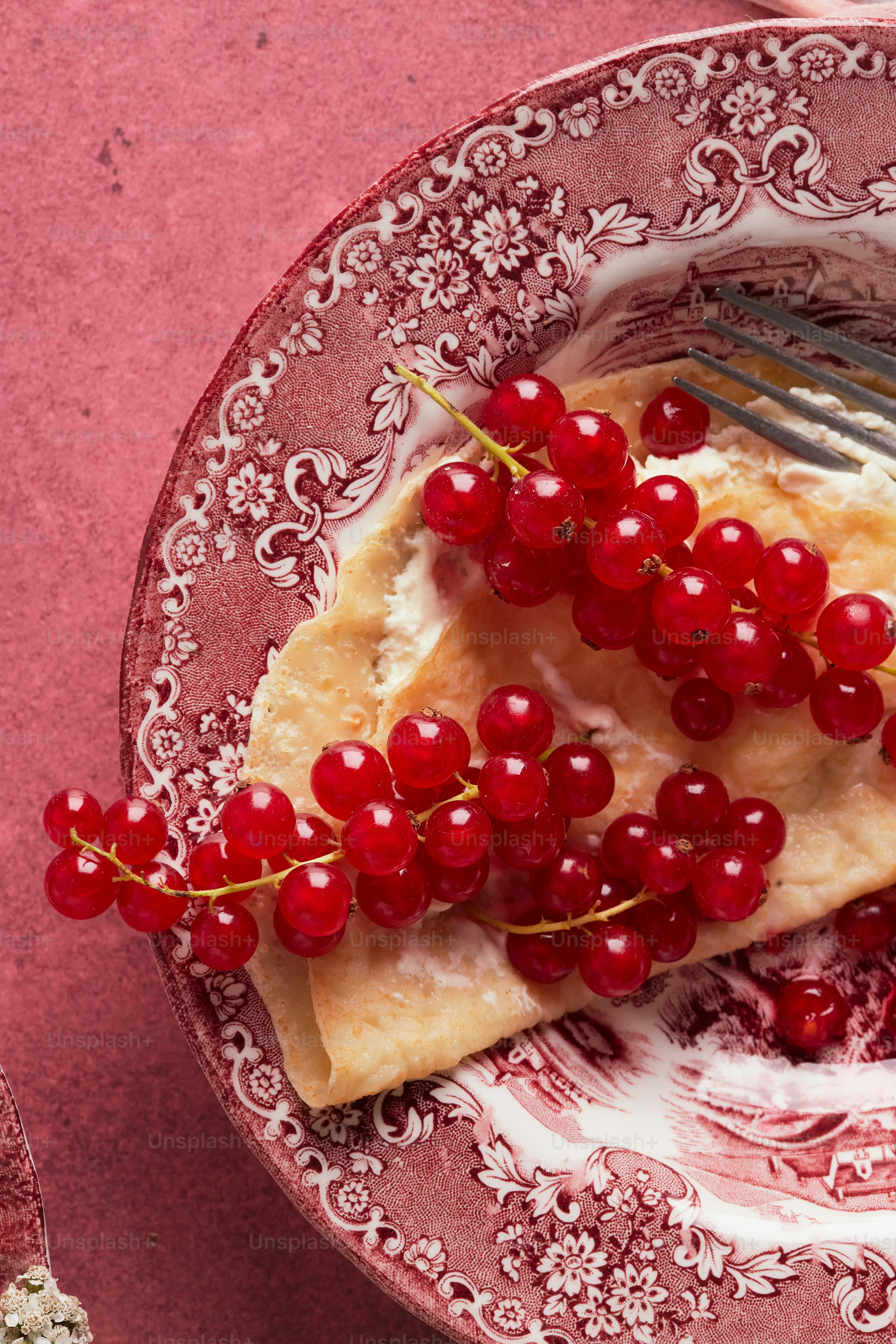 Crepes on a red surface