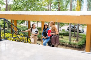 a group of women walking down a flight of stairs