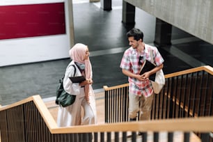 a couple of people that are standing on some stairs