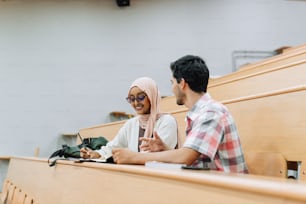 a man and a woman sitting in a pew together