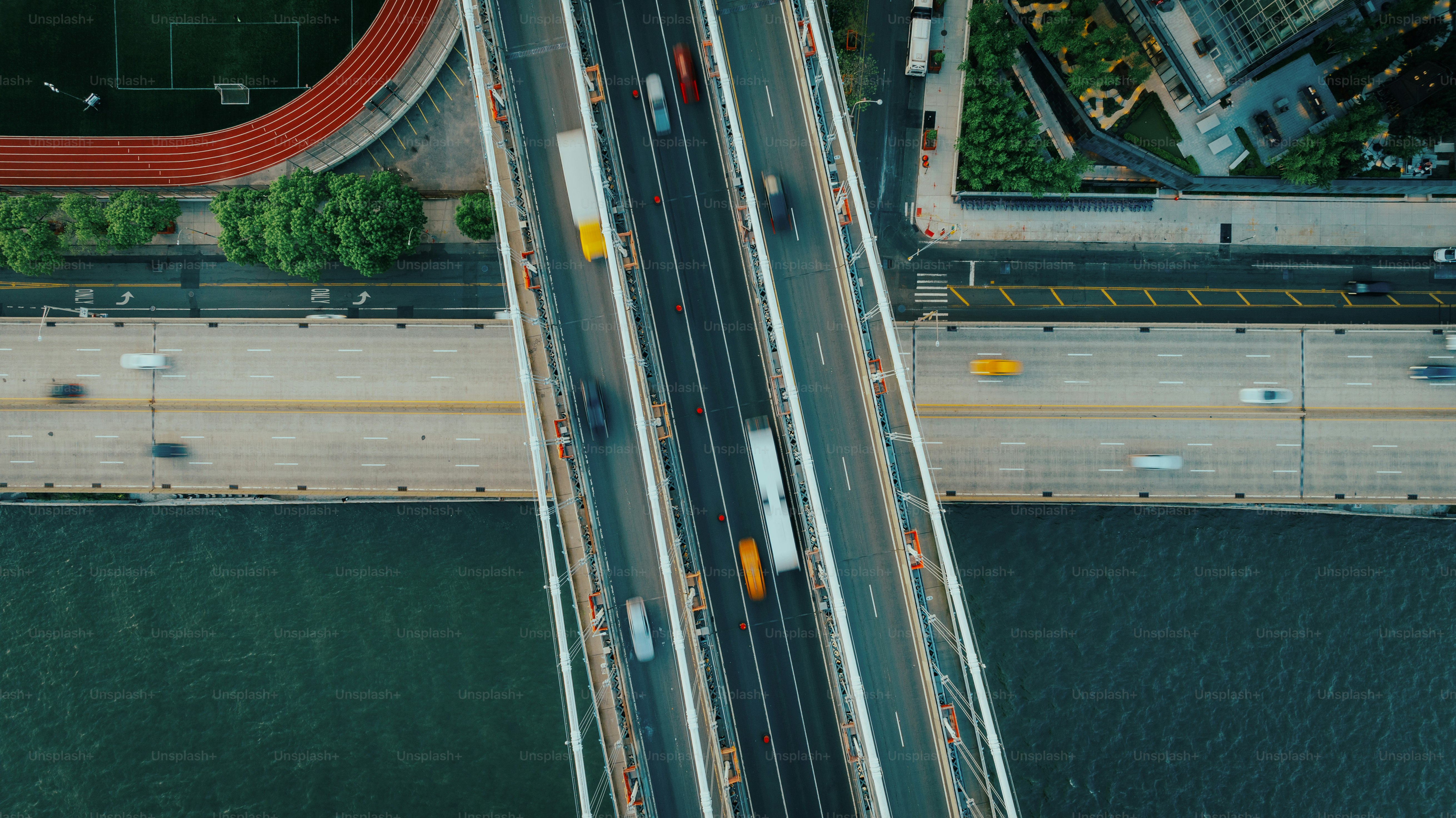 an aerial view of a bridge over a body of water