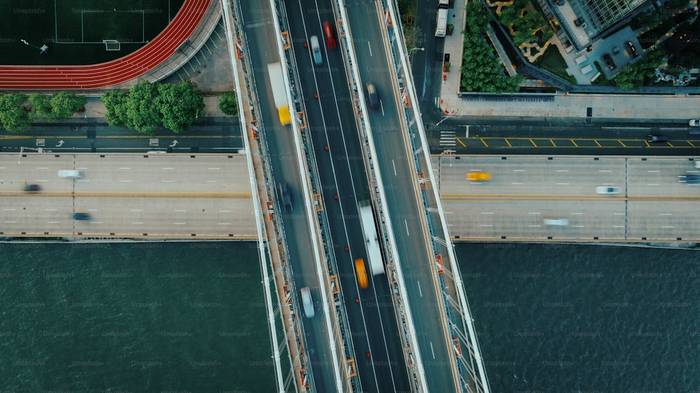 an aerial view of a bridge over a body of water