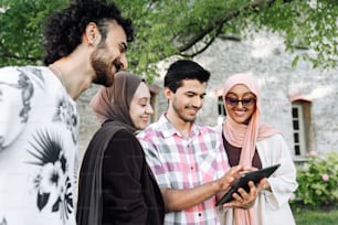 a group of people standing next to each other