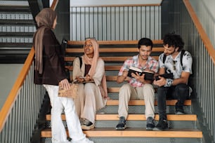 a group of people sitting on a set of stairs