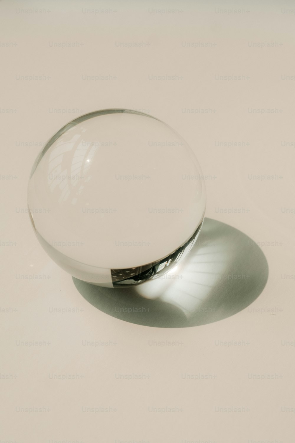 a glass bowl sitting on top of a white table