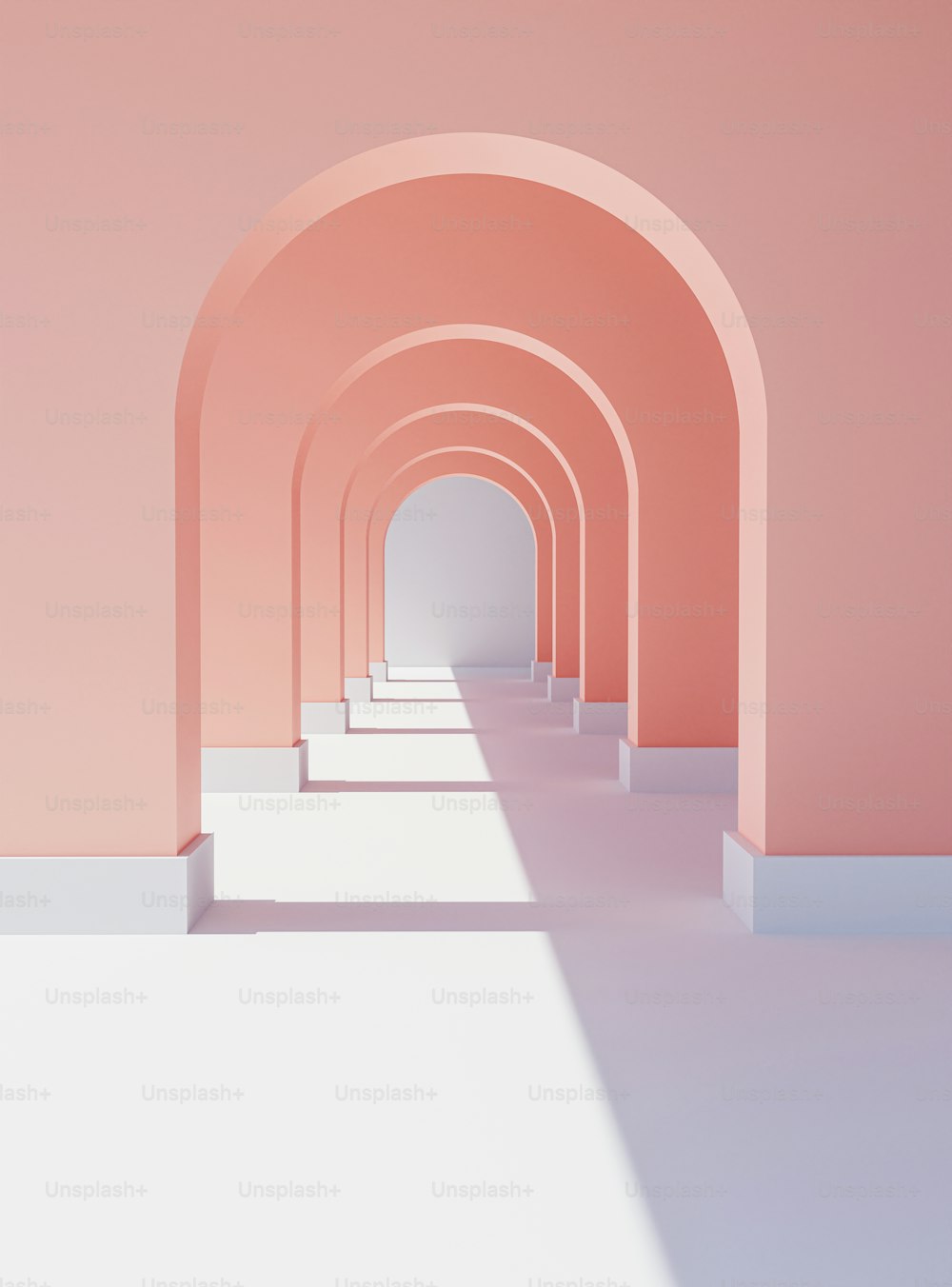 a long hallway with a pink wall and a white floor