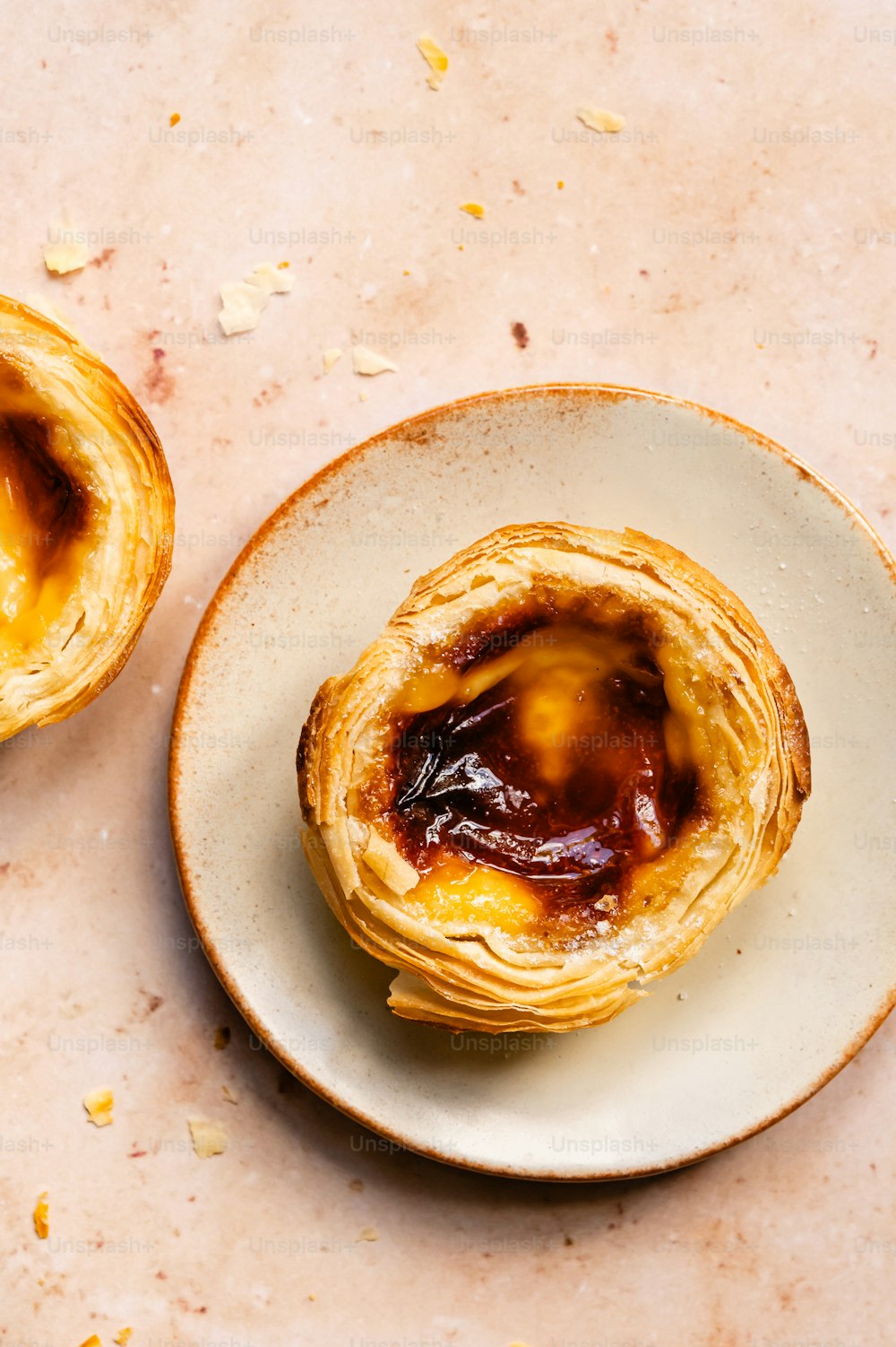 a plate with a pastry on top of it