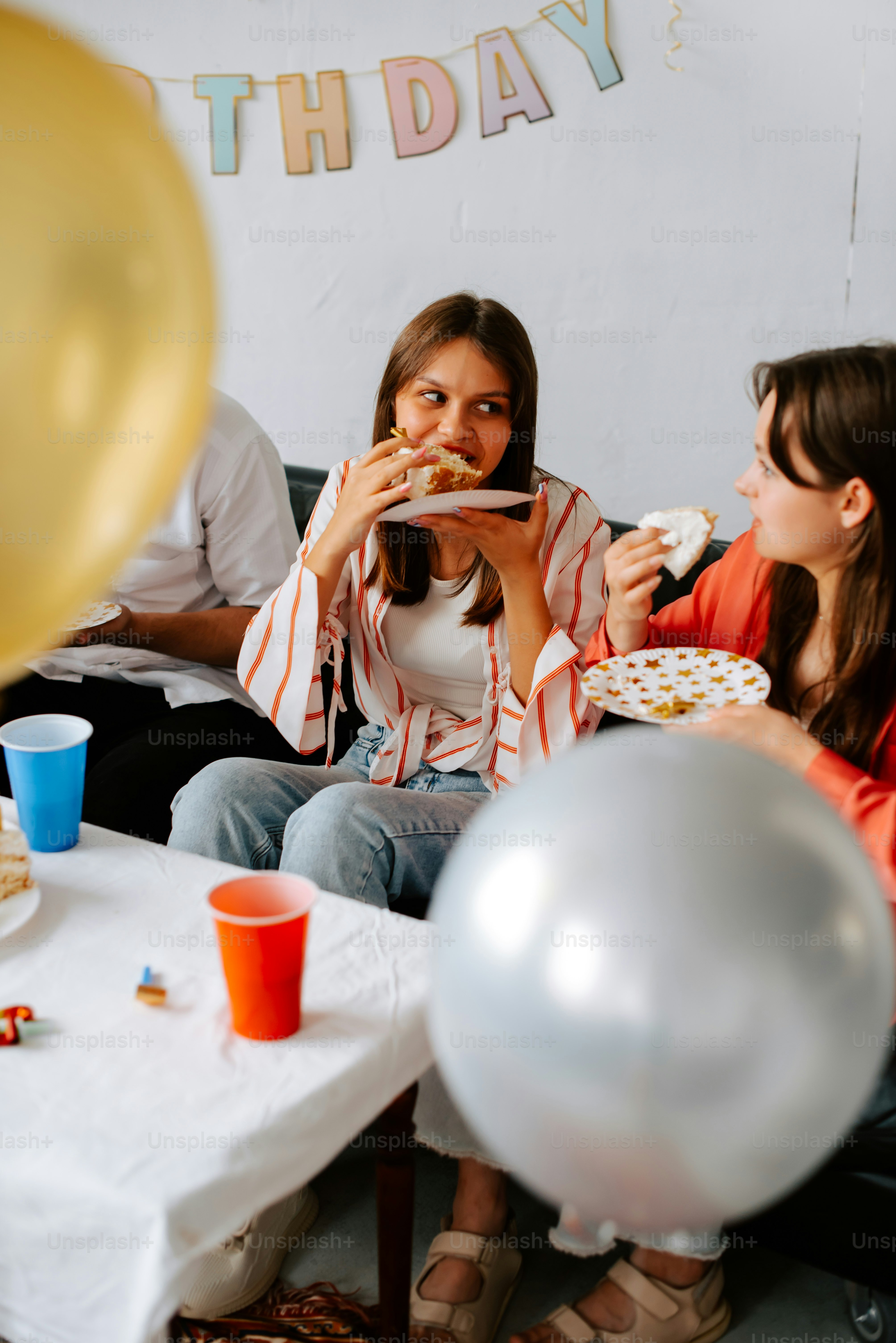 a group of people sitting around a table eating food