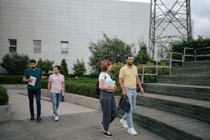 a group of people walking up some steps