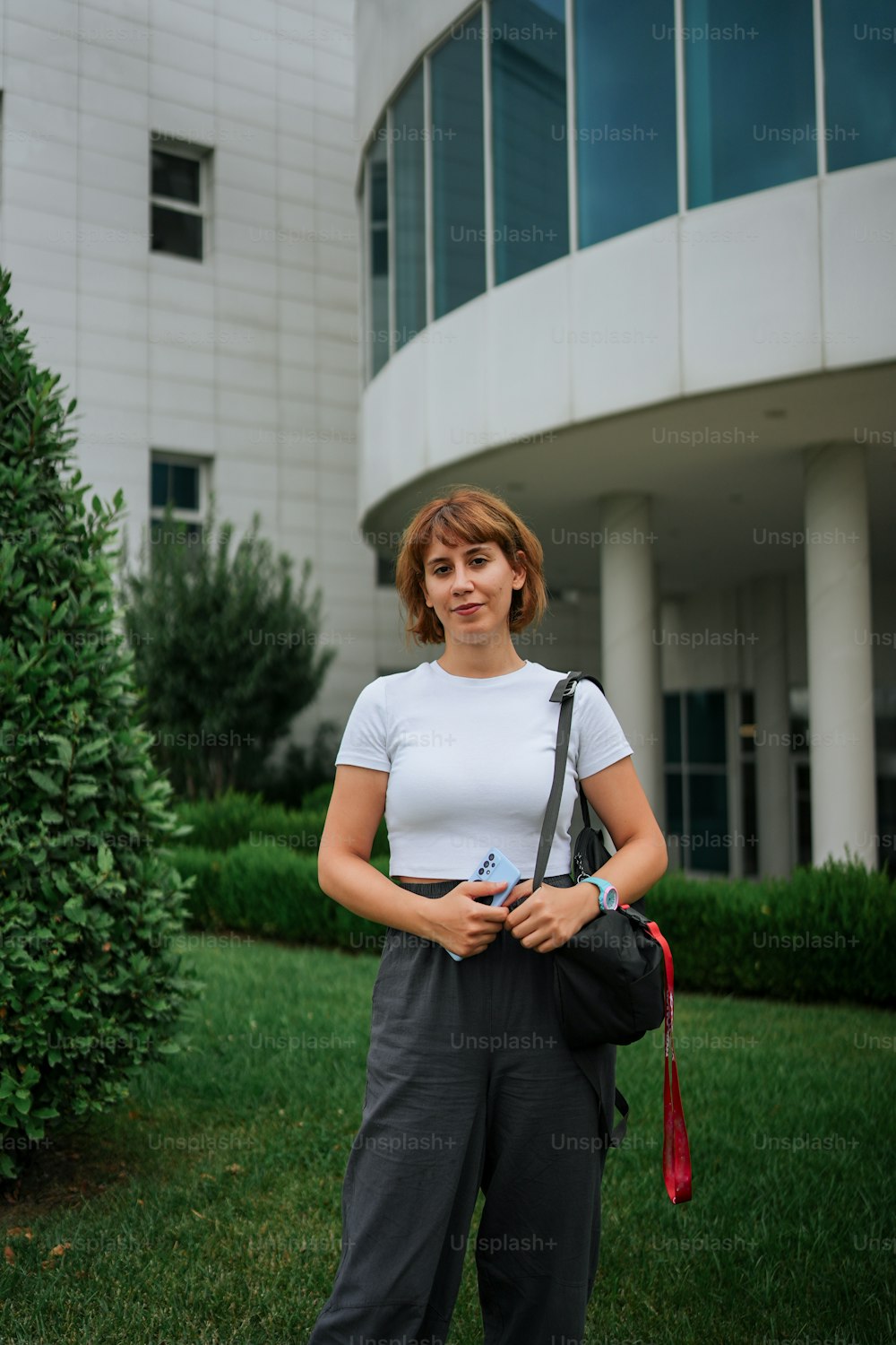 a woman standing in front of a building