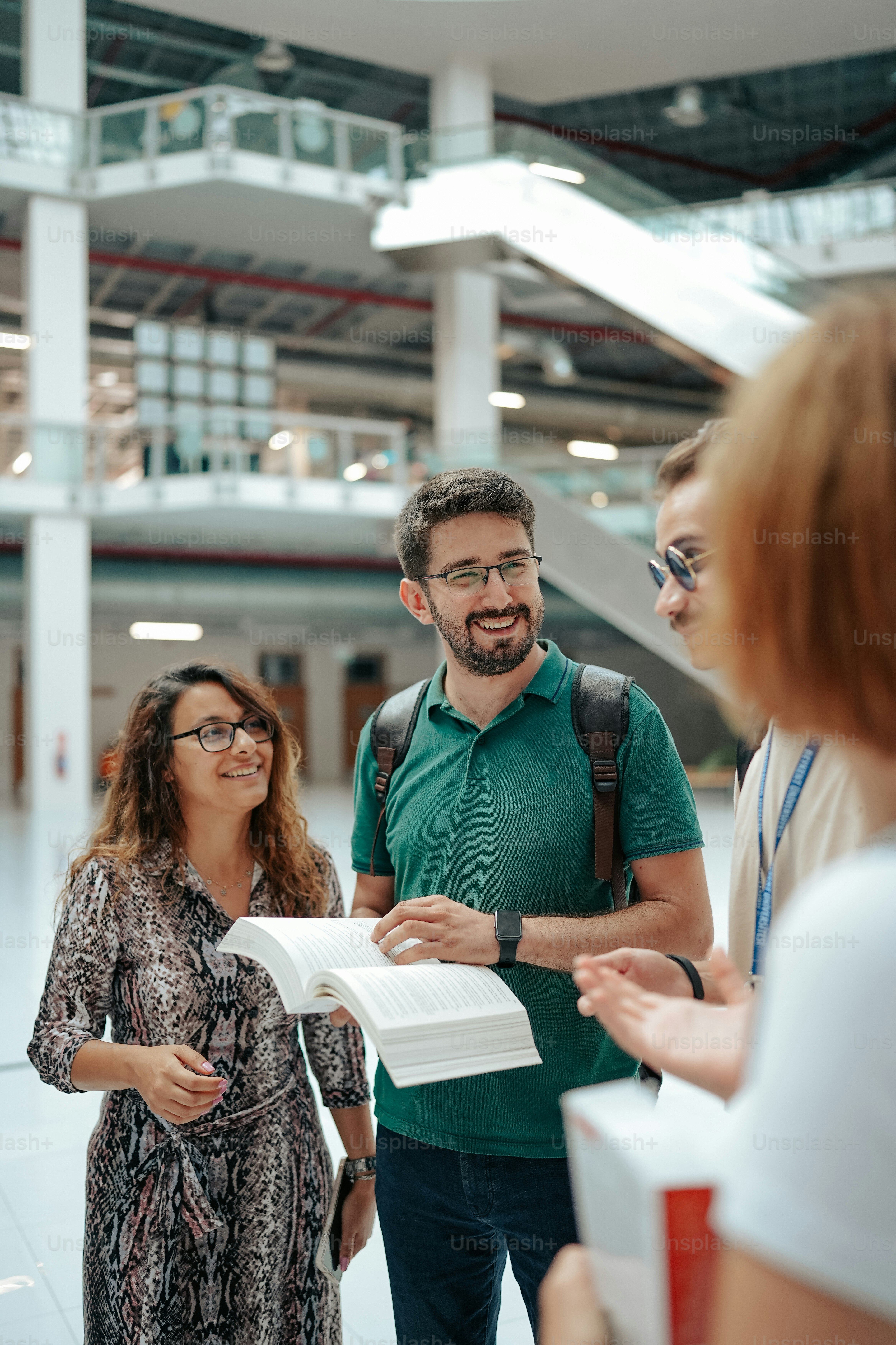 a group of people standing around each other