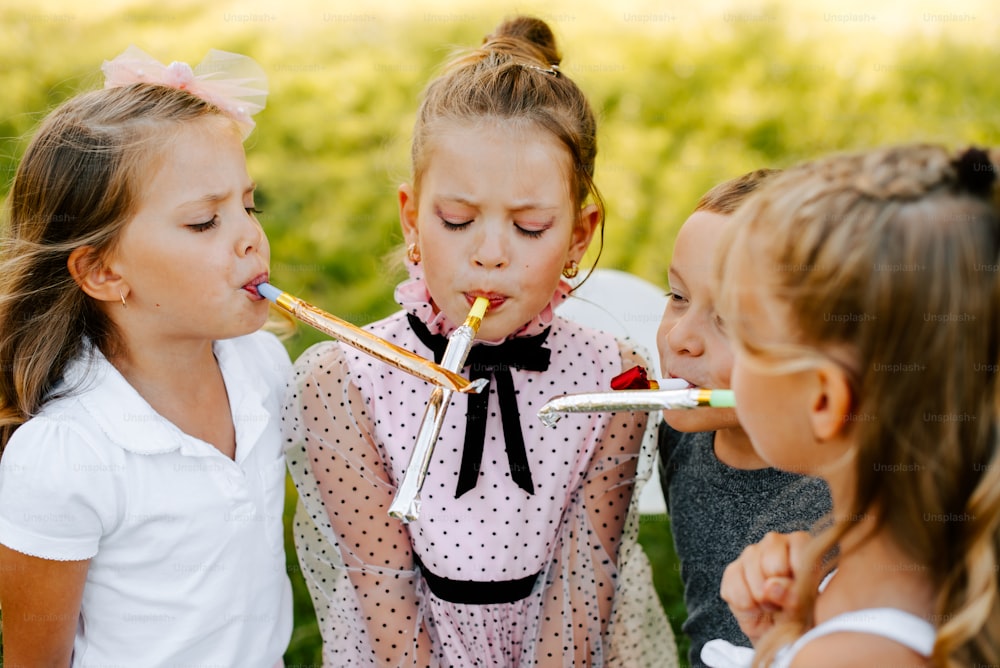 a group of young girls standing next to each other