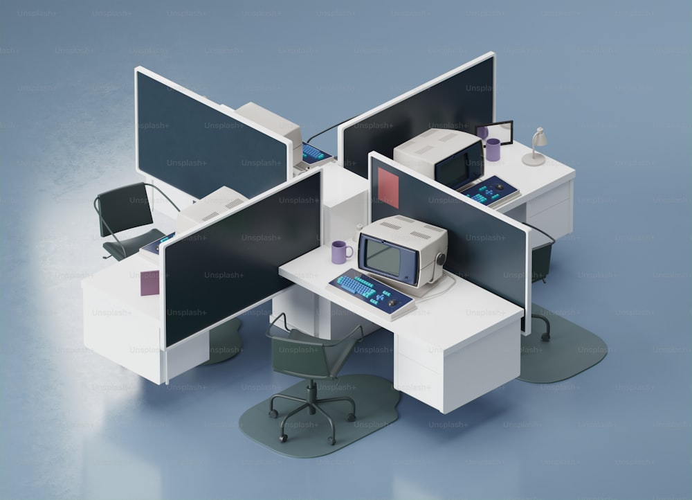 an office cubicle with three monitors and a computer