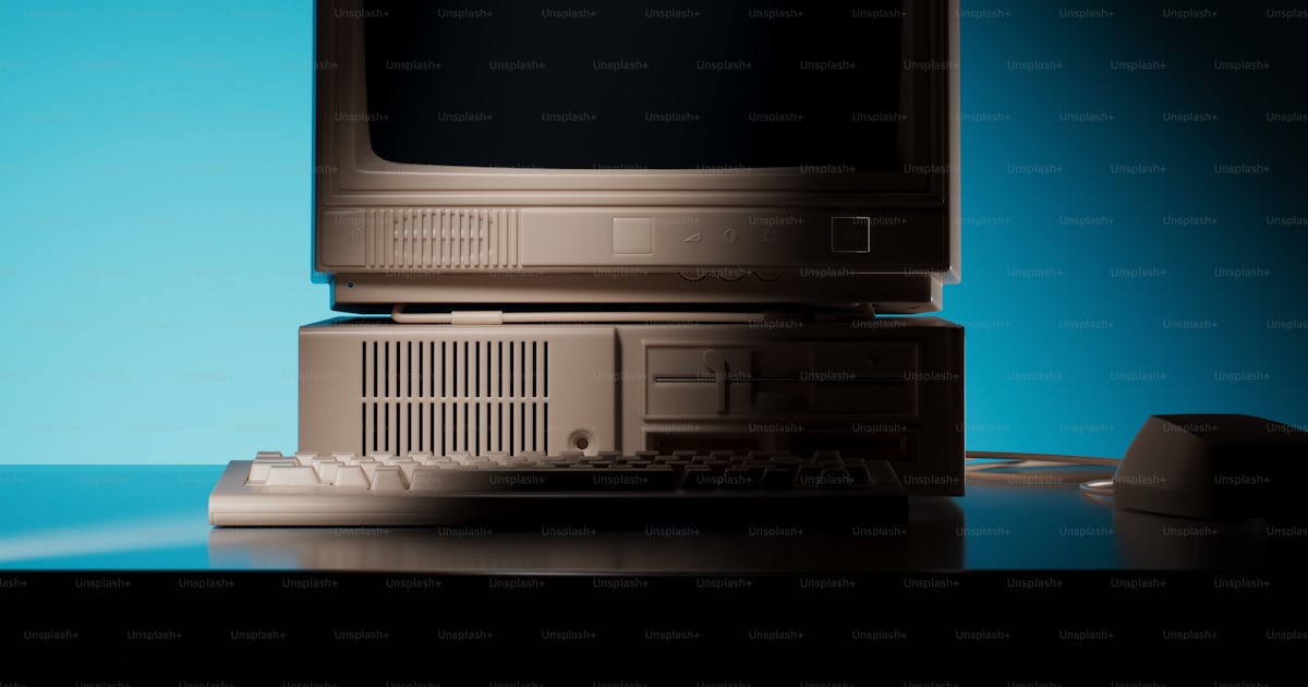 A computer monitor sitting on top of a desk photo – Office Image on ...