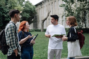 a group of people standing around each other