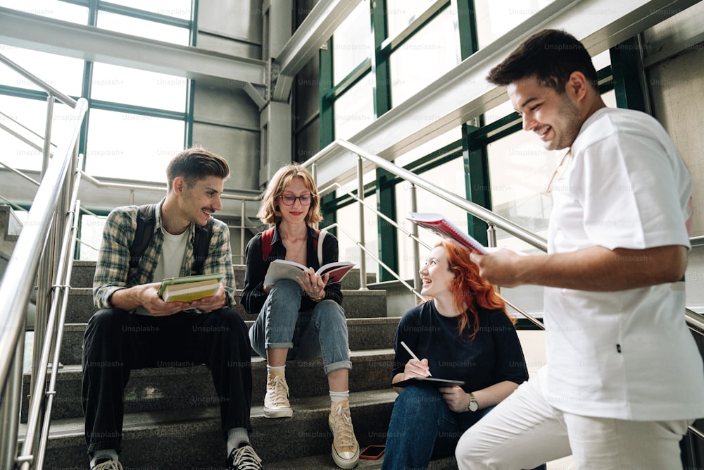 a group of people sitting on the steps of a building