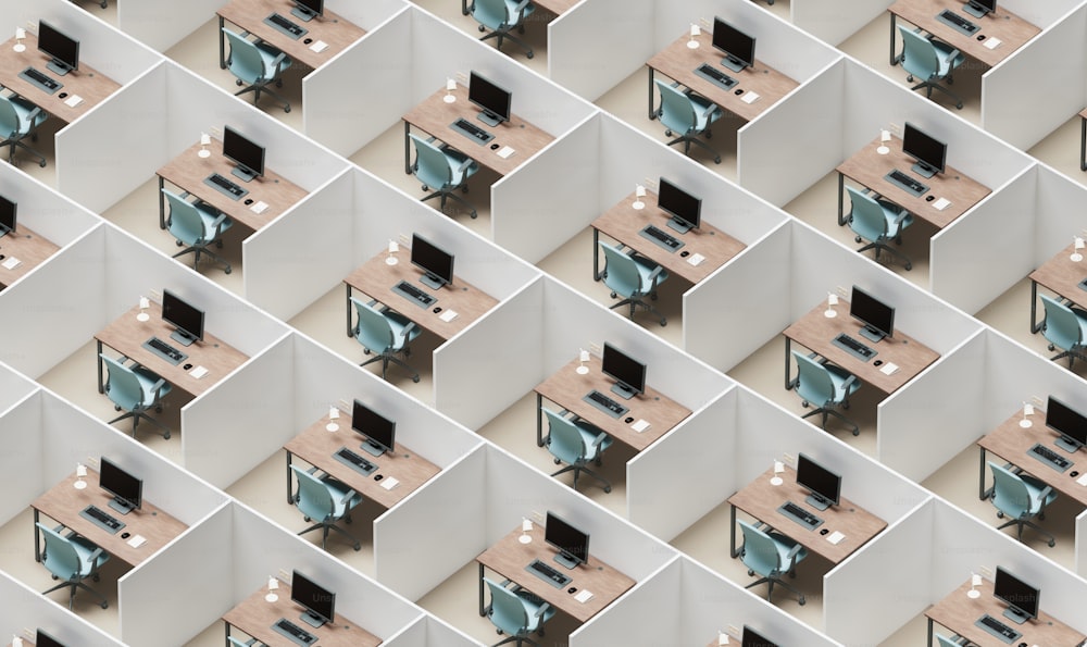 a wall of cubicles with a computer monitor and keyboard