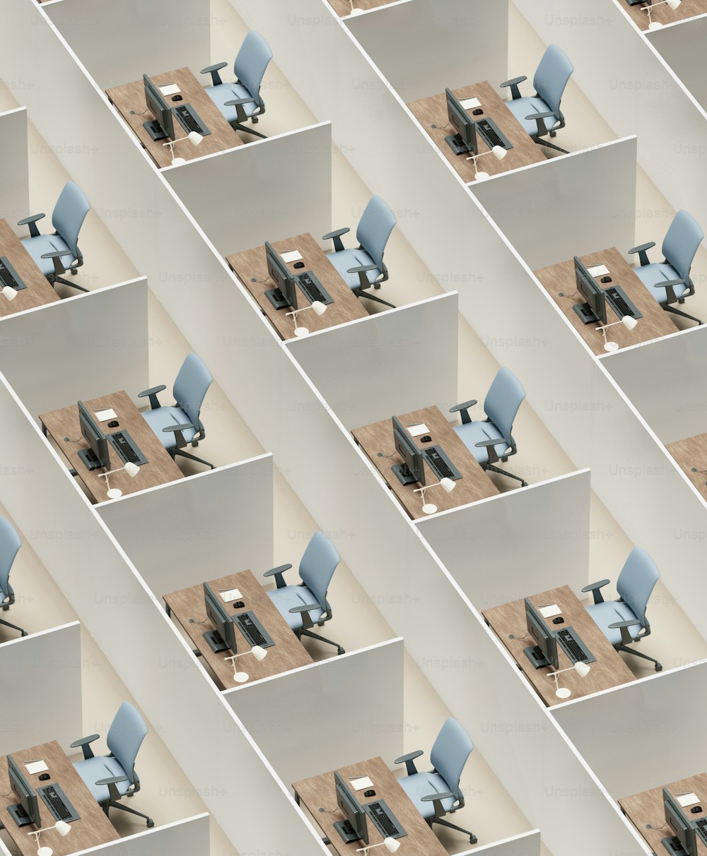 a wall of cubicles with a computer on top of them