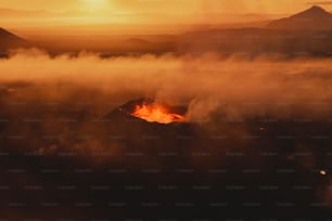 a mountain with a fire in the middle of it