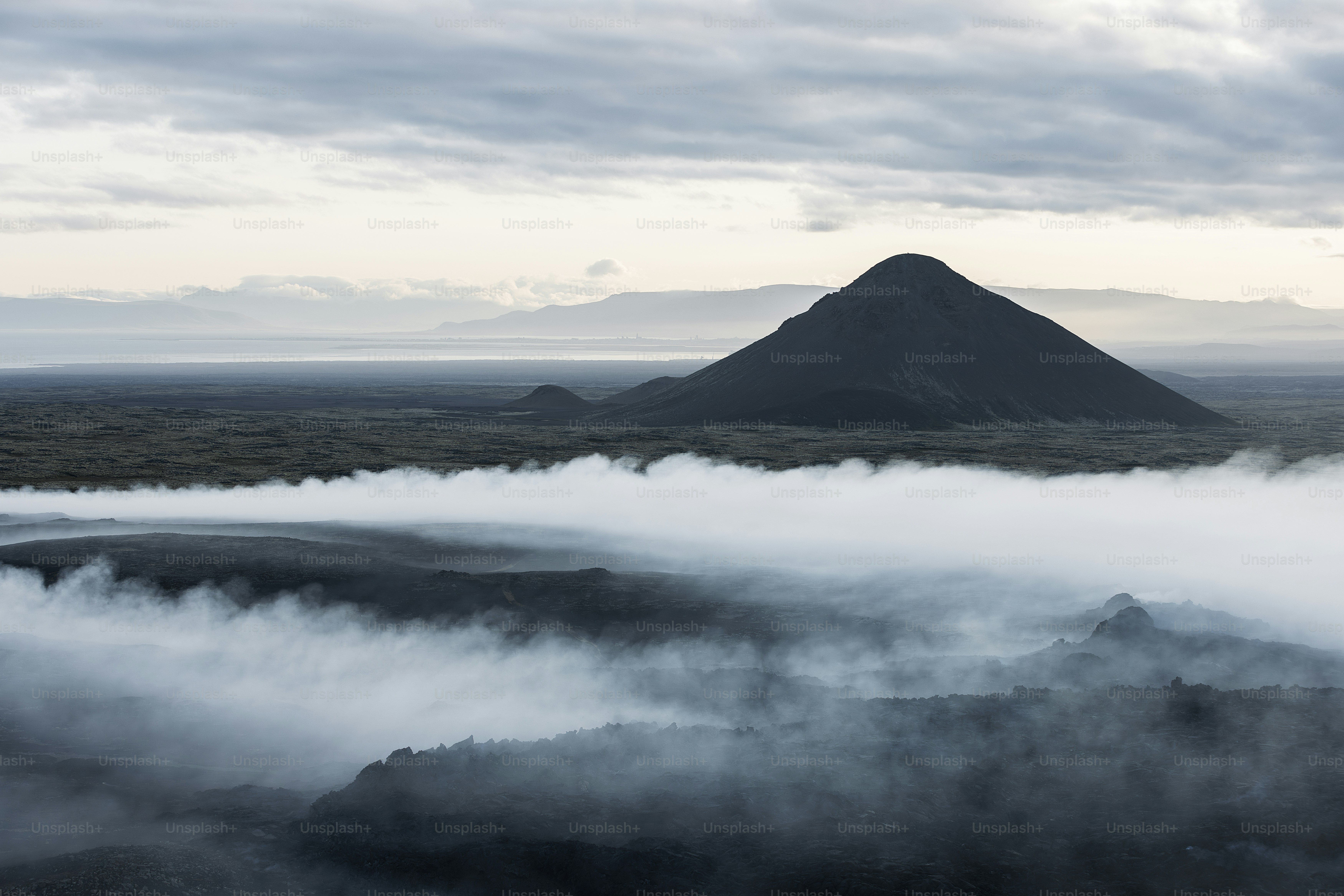 A volcano spewing out lava at sunset photo – Smoke Image on Unsplash