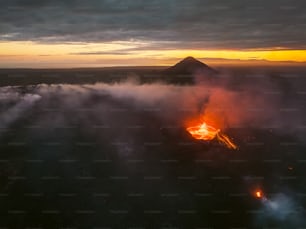 an aerial view of a volcano in the middle of the night