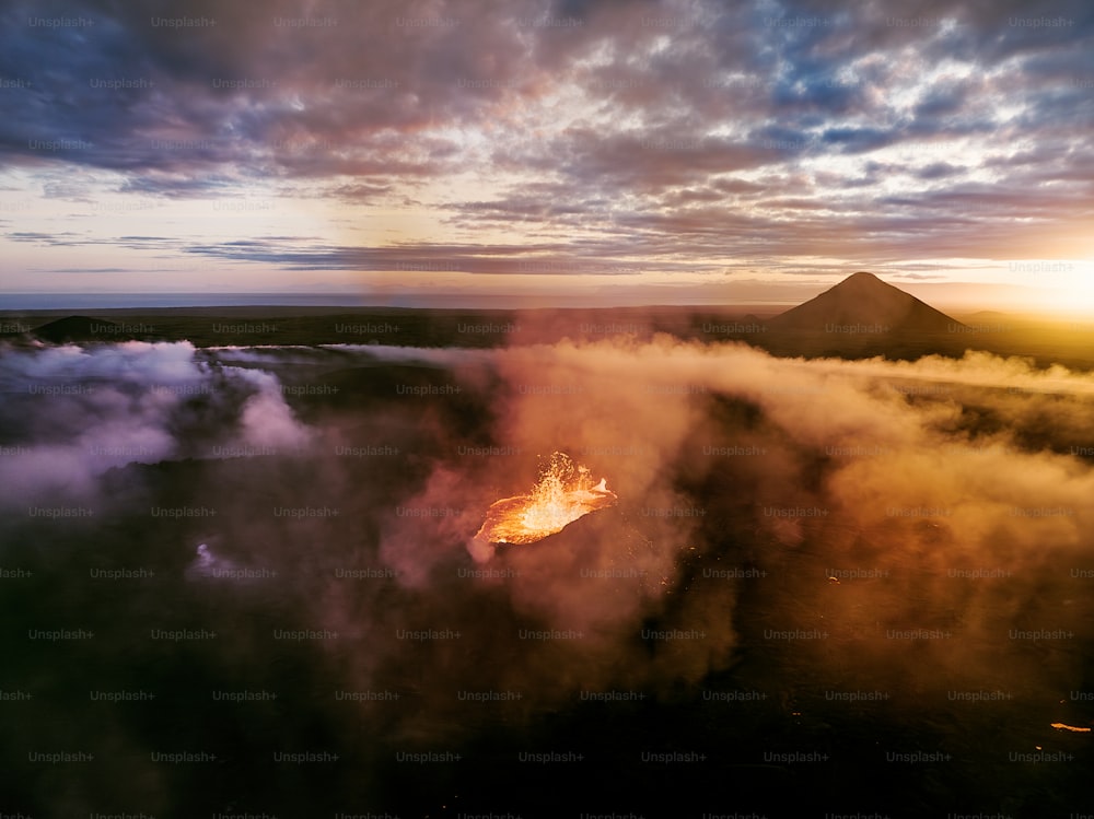 a large fire burning in the middle of a forest