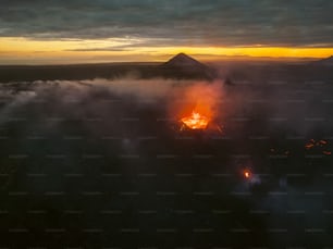 an aerial view of a volcano in the middle of the night