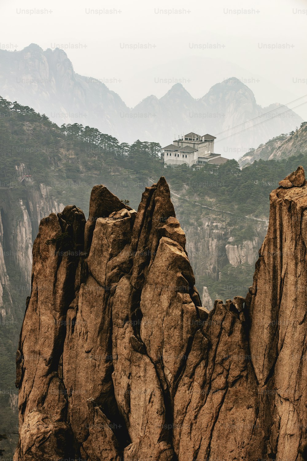 a mountain with a house on top of it