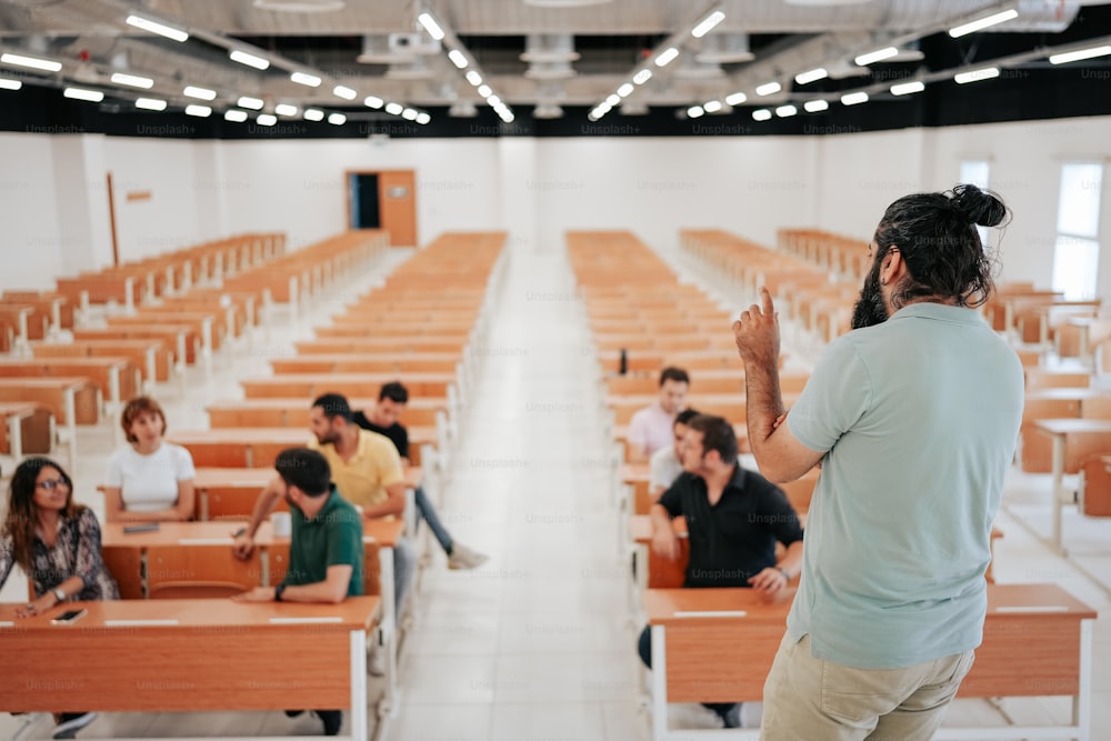 a woman standing in front of a classroom full of students