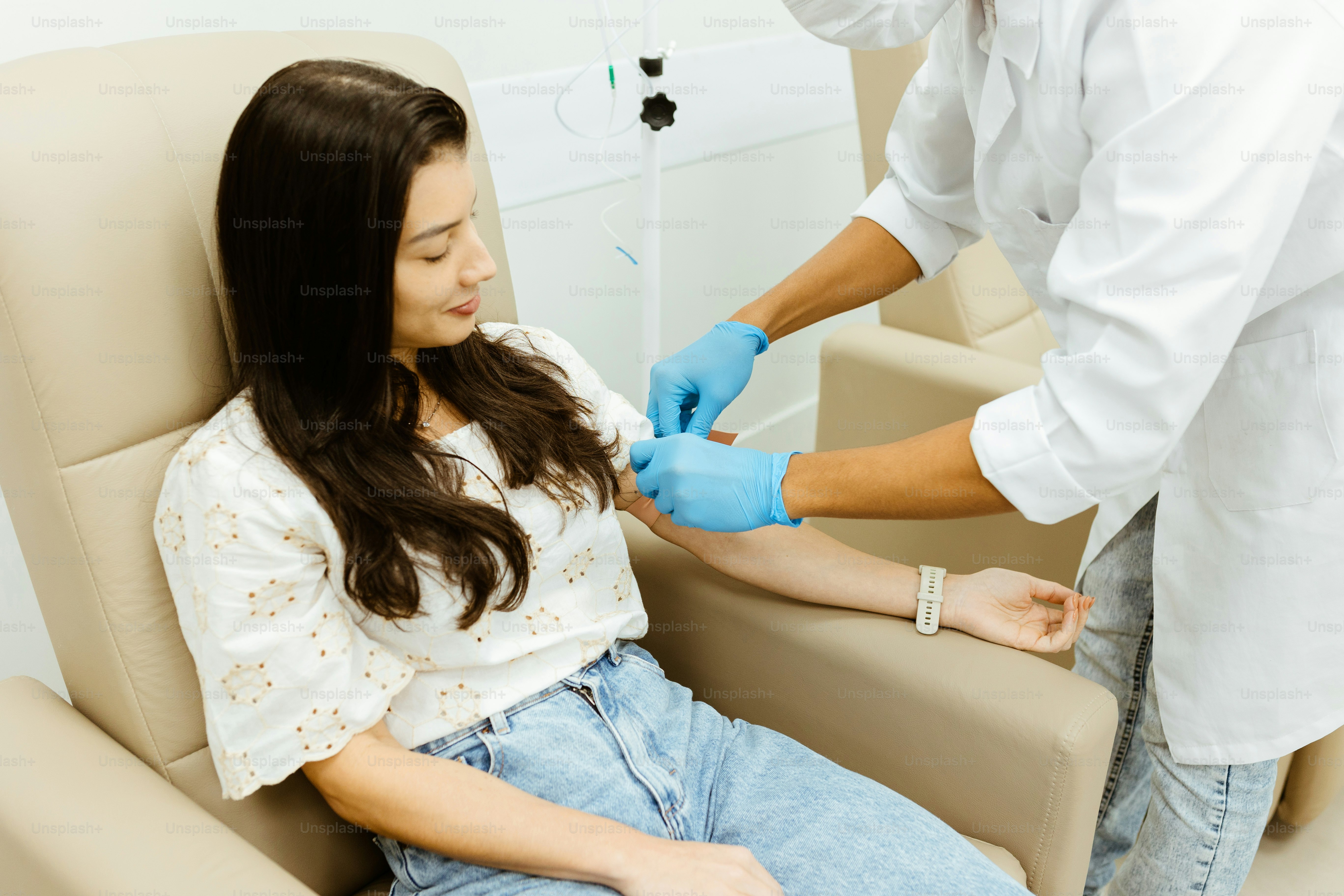 a woman getting her teeth checked by a dentist
