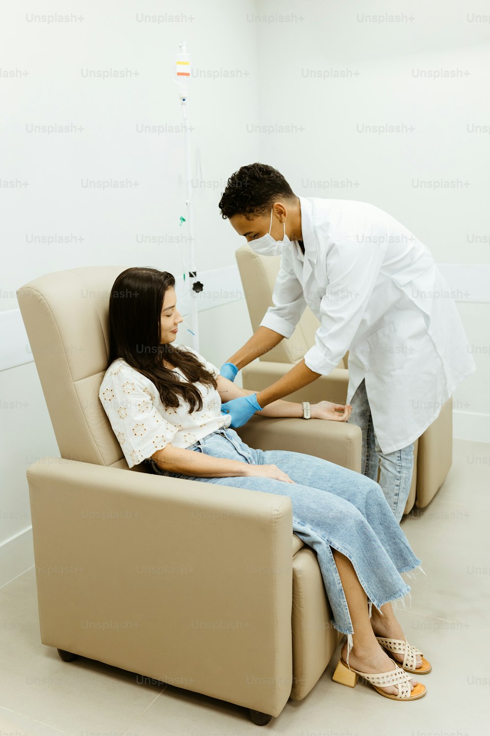 a woman getting her teeth checked by a dentist