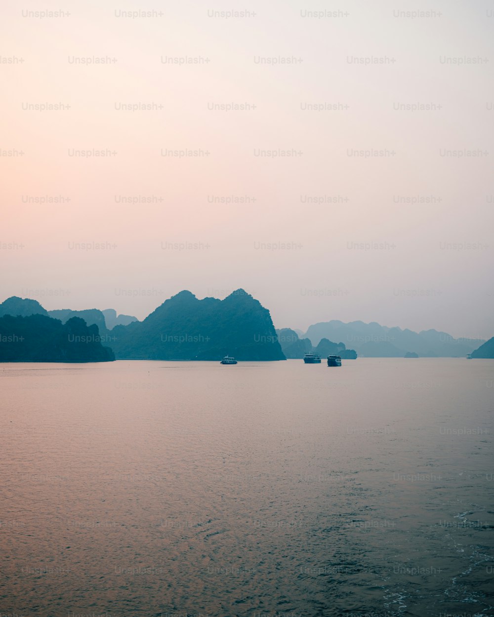 a body of water with mountains in the background