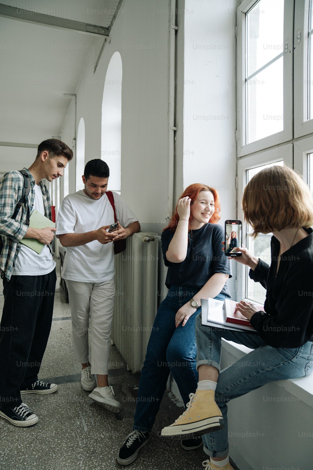 a group of people standing around a room