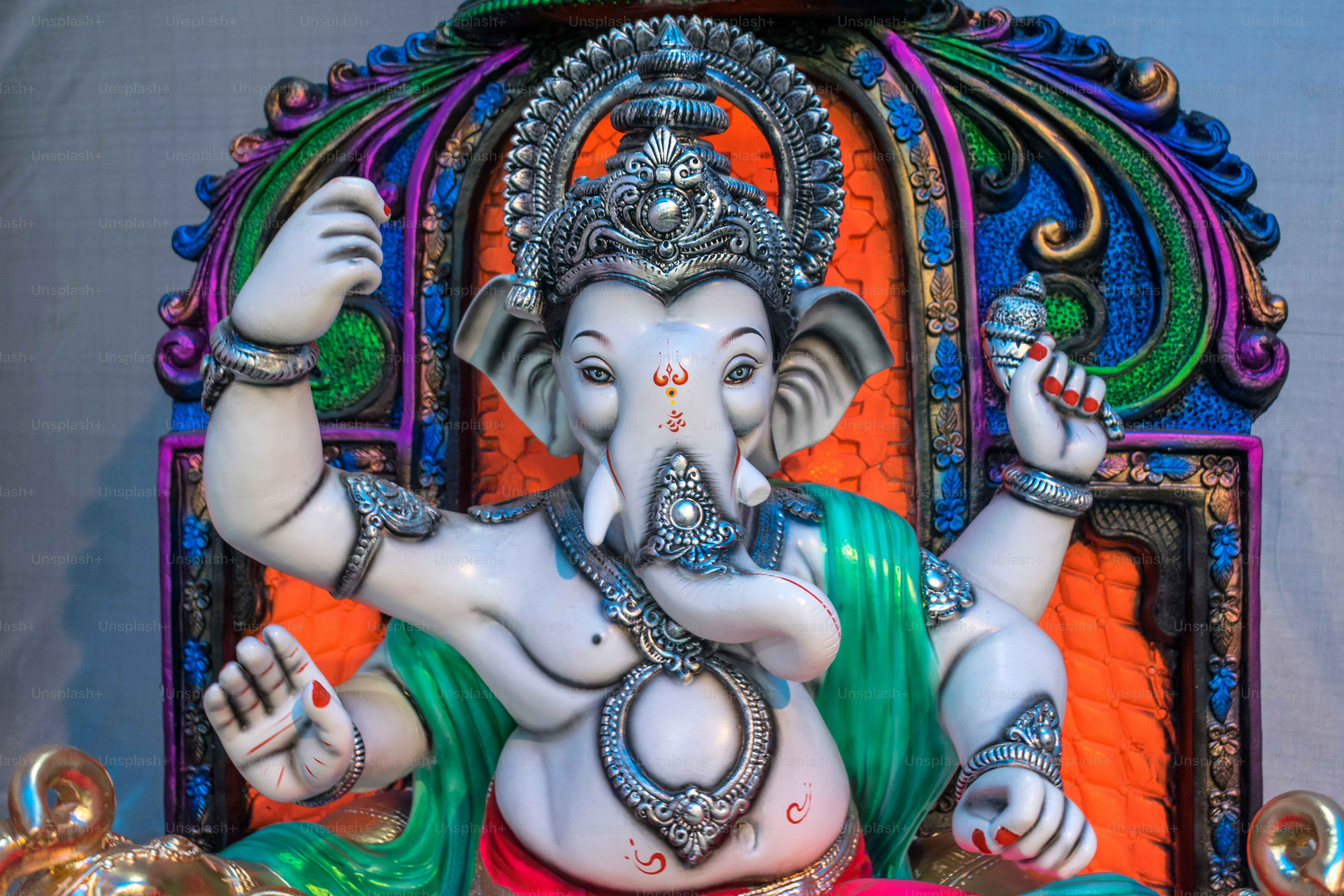 a statue of an elephant with a crown on it's head