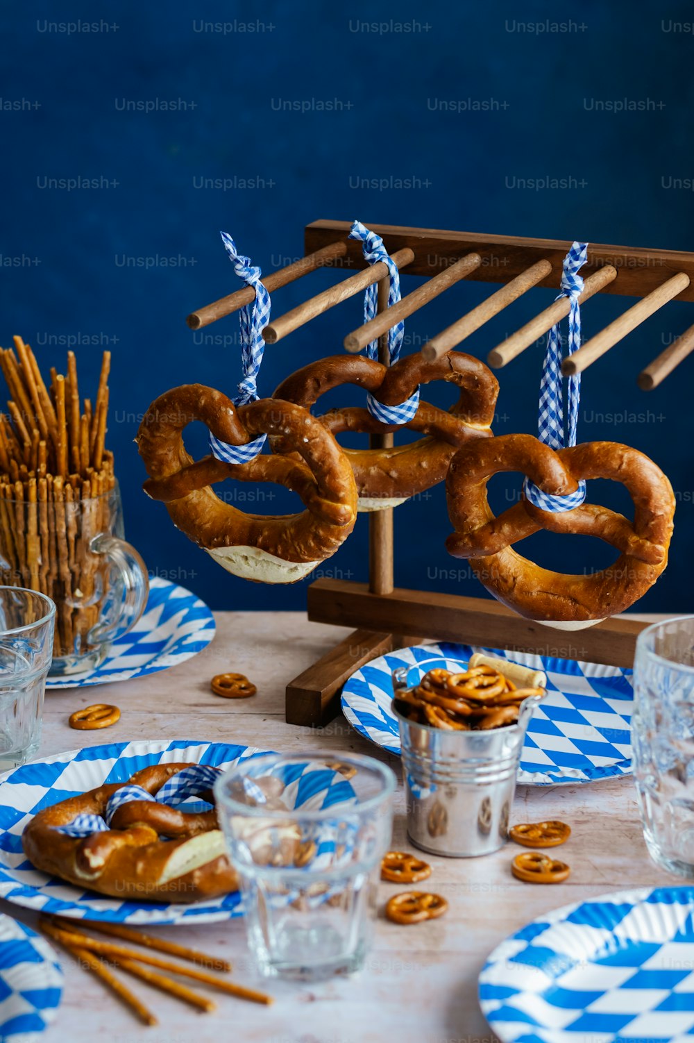 a table topped with plates of pretzels and pretzels