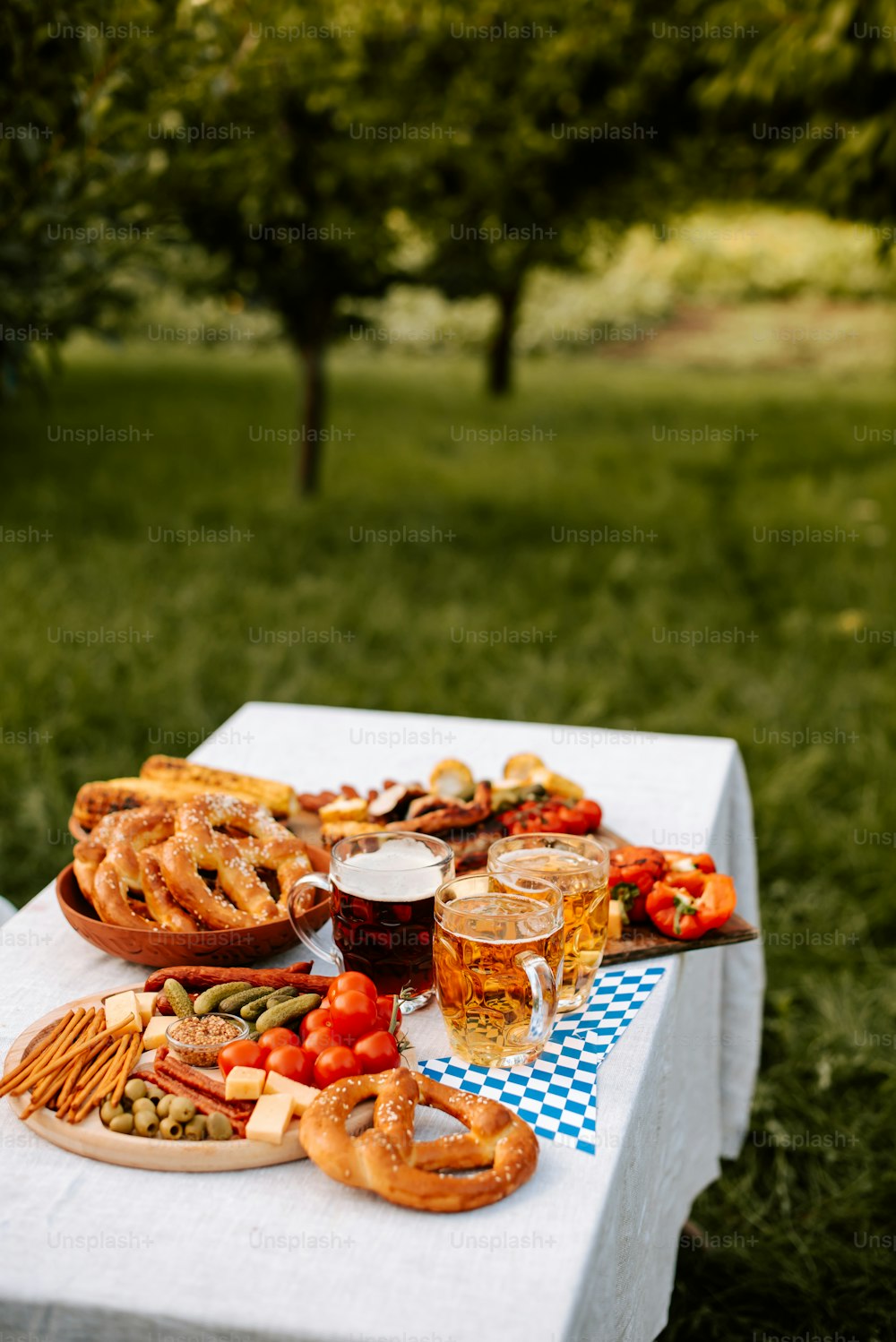 a picnic table with food and drinks on it
