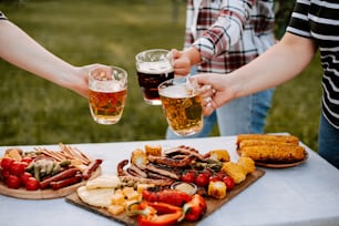 a group of people holding glasses of beer