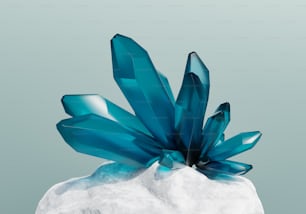 a blue object sitting on top of a white rock