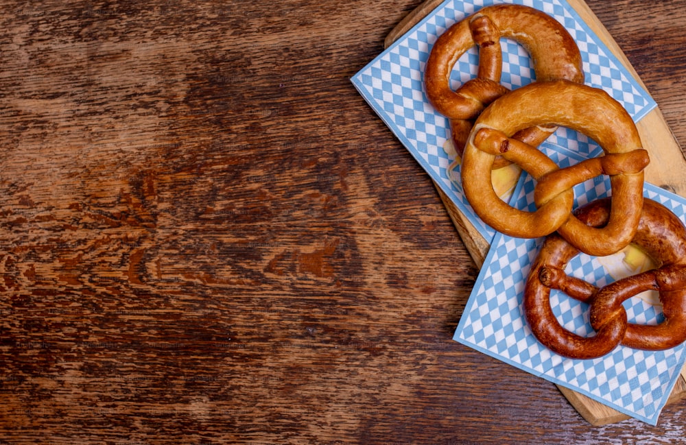a couple of pretzels sitting on top of a wooden table