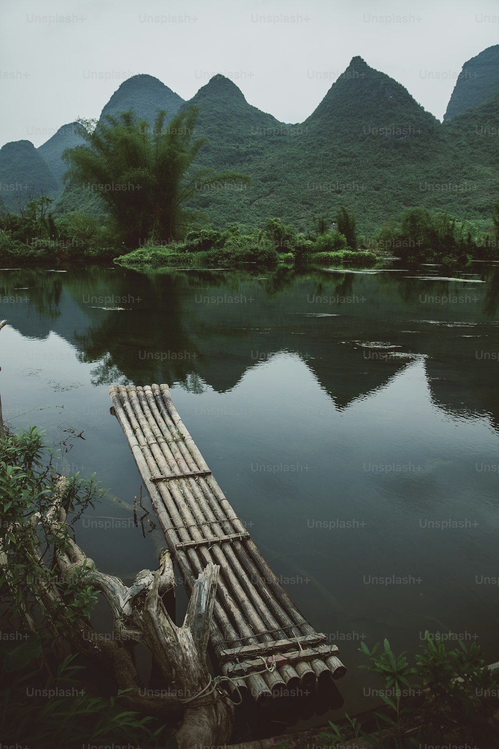 a wooden raft floating on top of a river