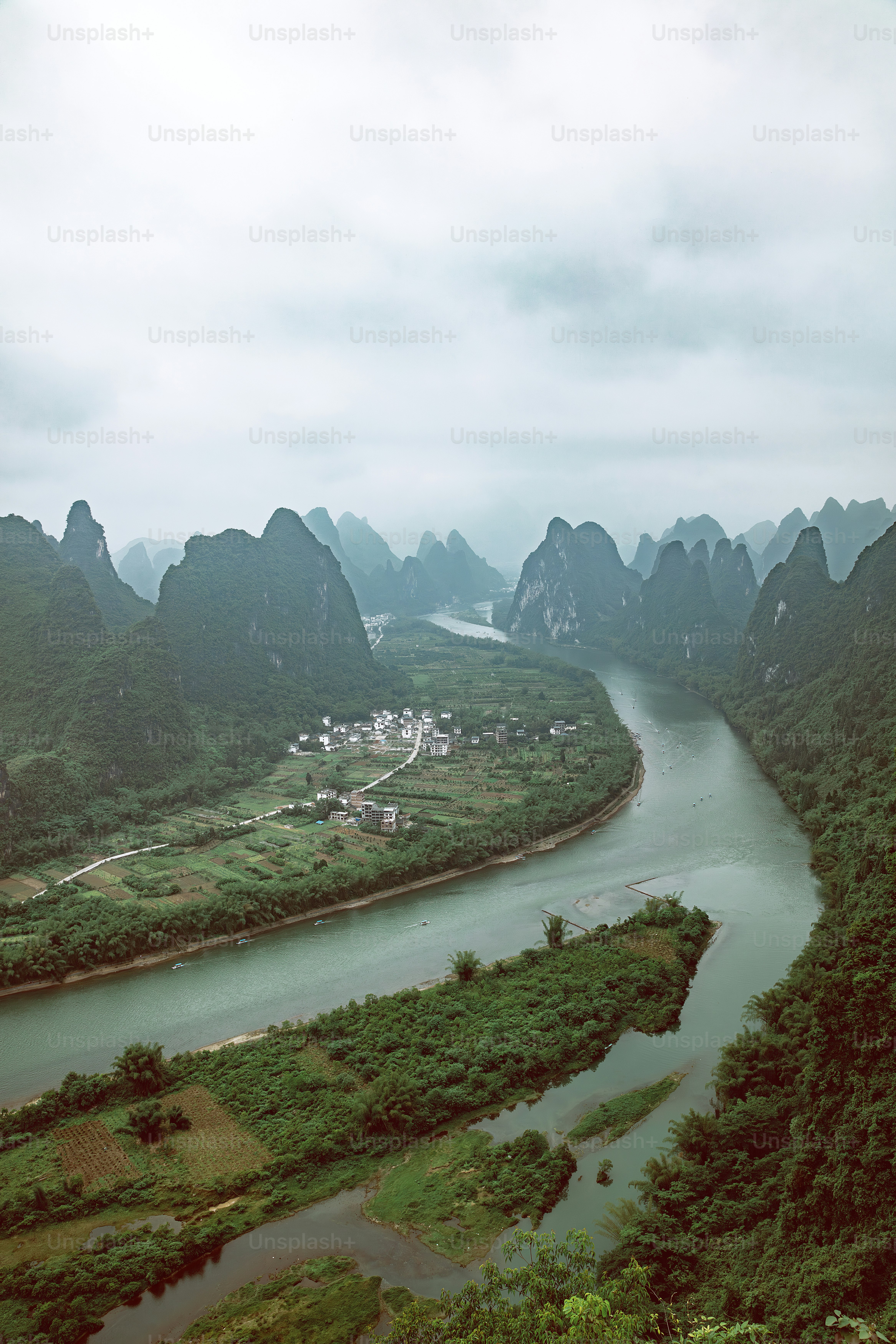 a river running through a lush green valley