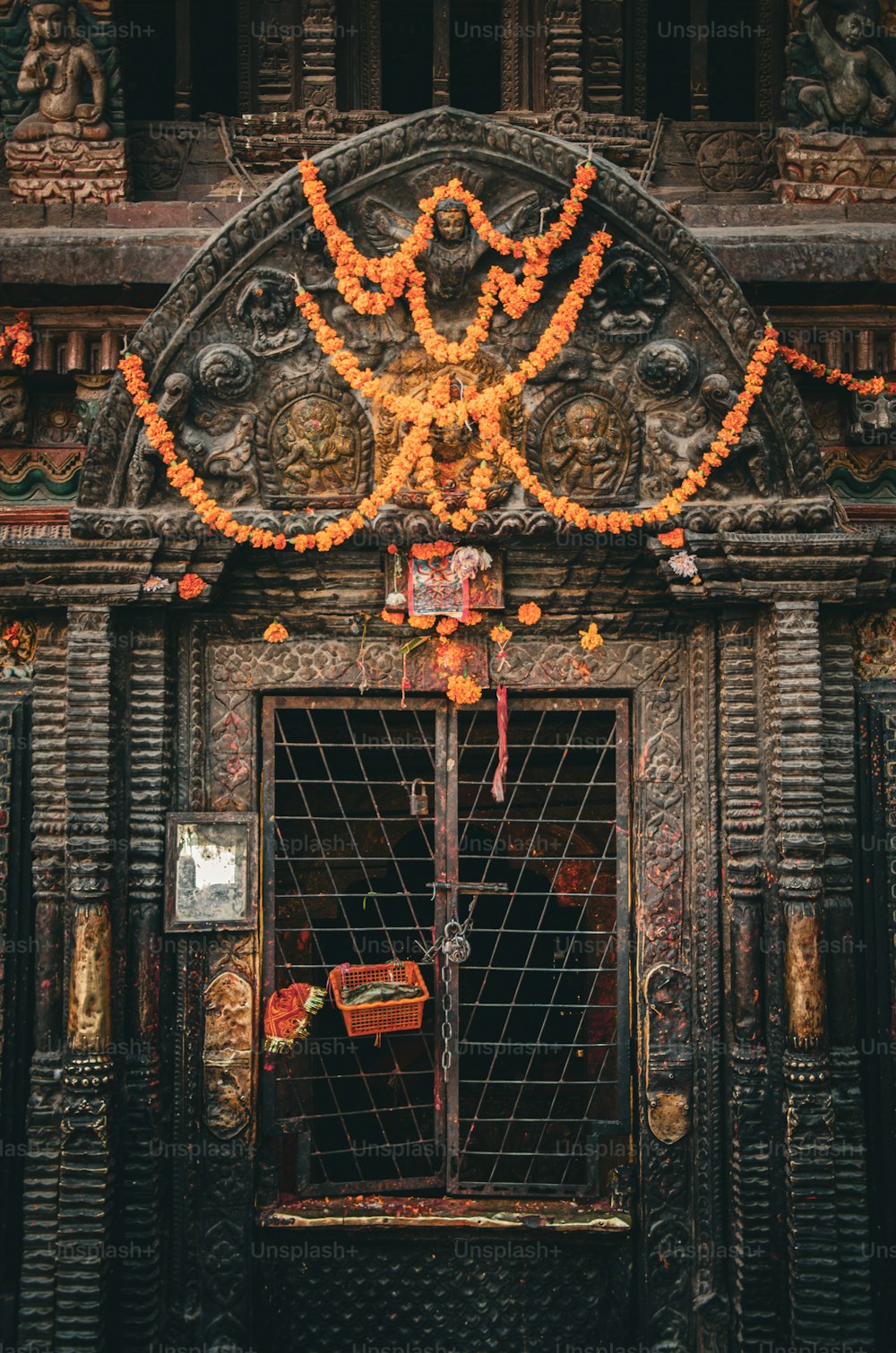 a large wooden building with a metal gate