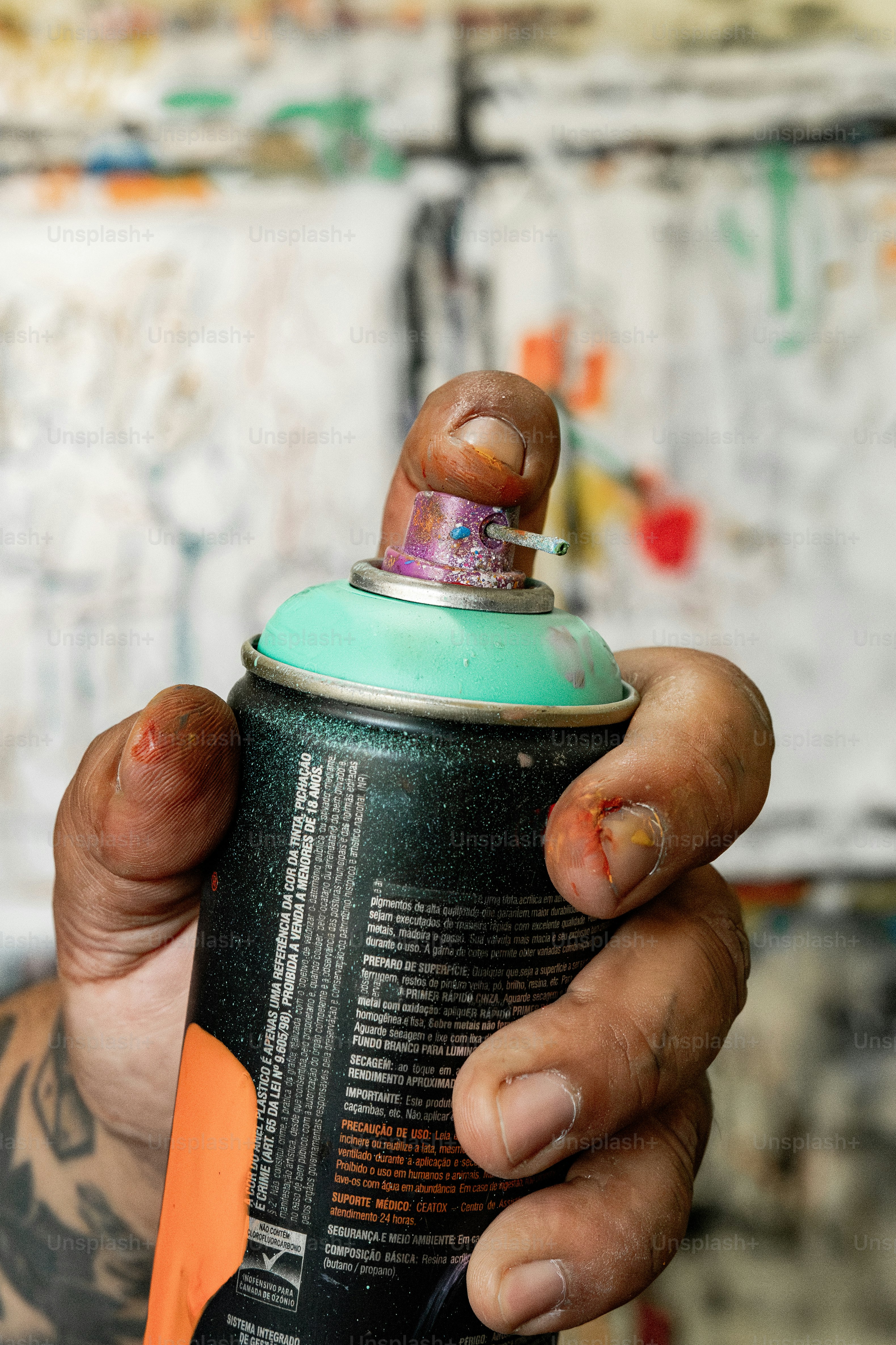 a person holding a can of beer in their hand