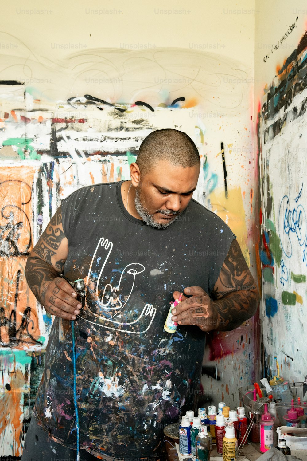 a man is painting in an art studio