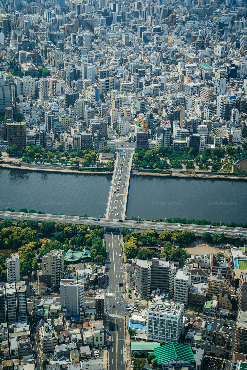 an aerial view of a city and a bridge