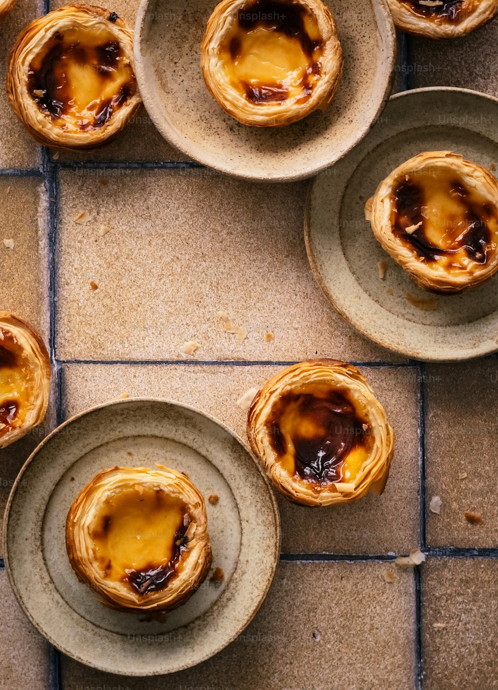 a table topped with plates filled with pastry