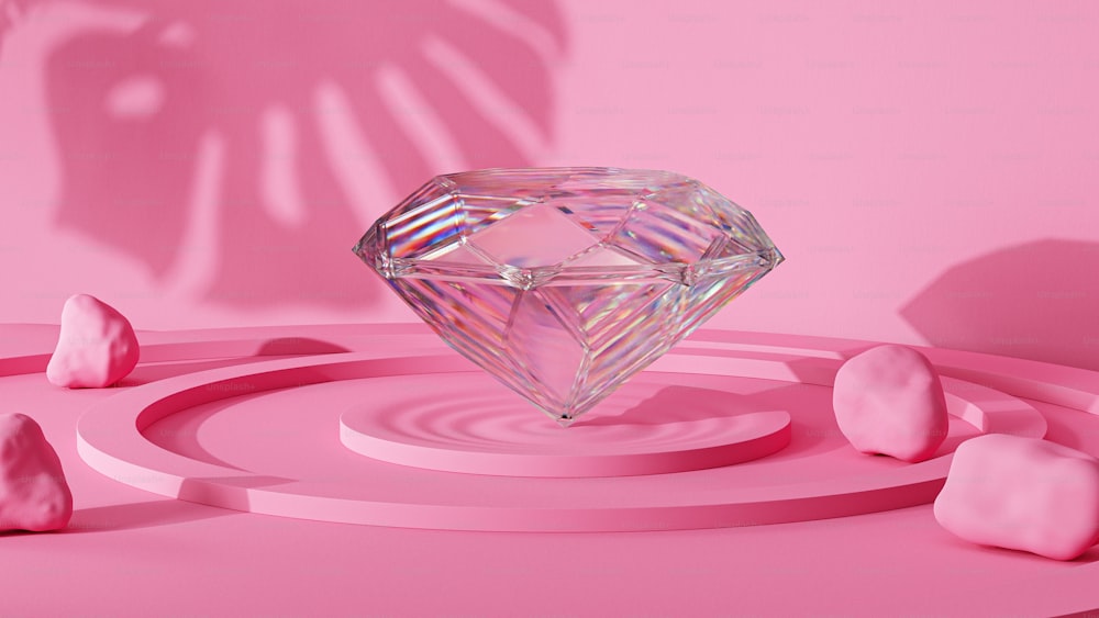 Un diamante rodeado de piedras rosadas sobre un fondo rosa