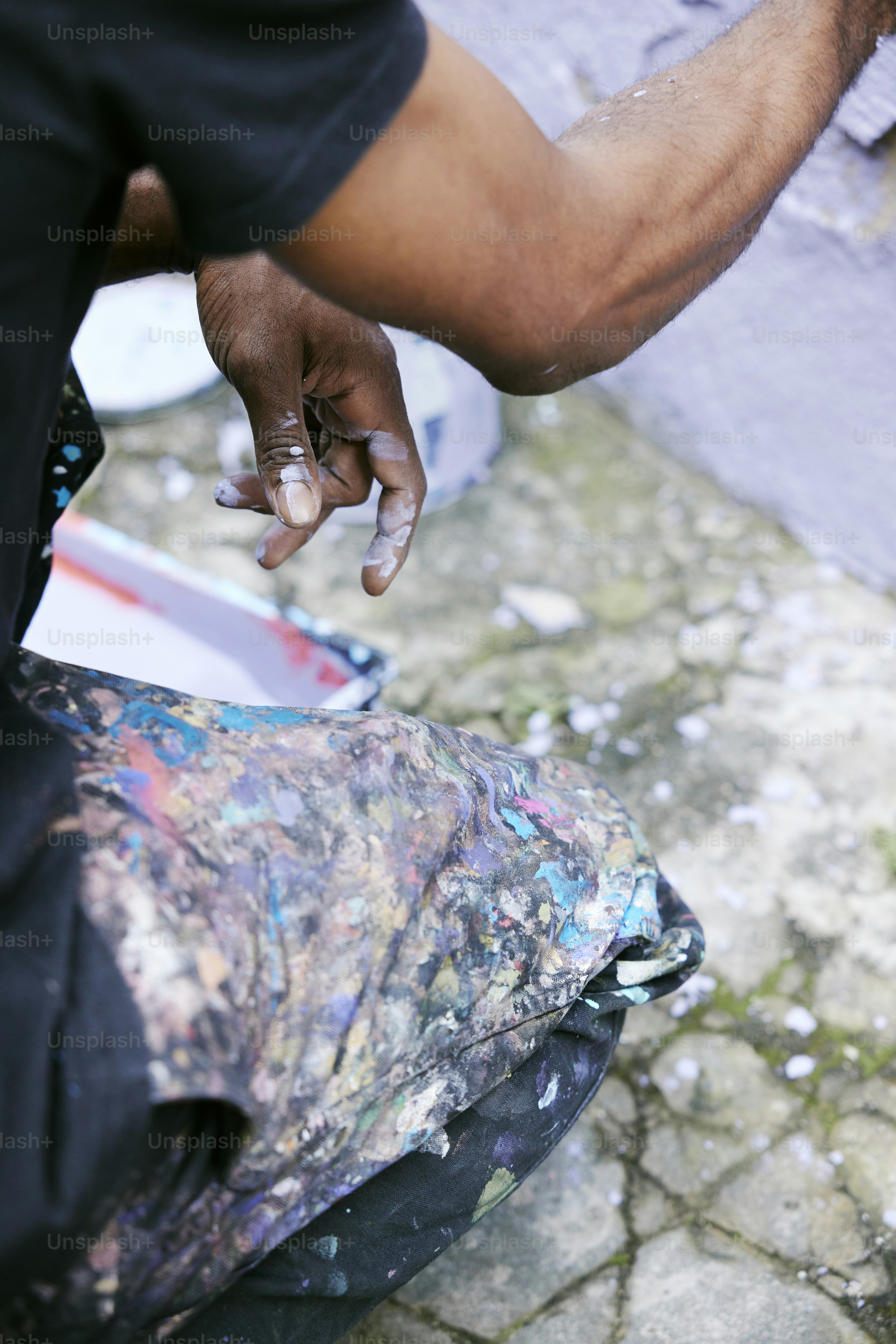 a man is painting a piece of art