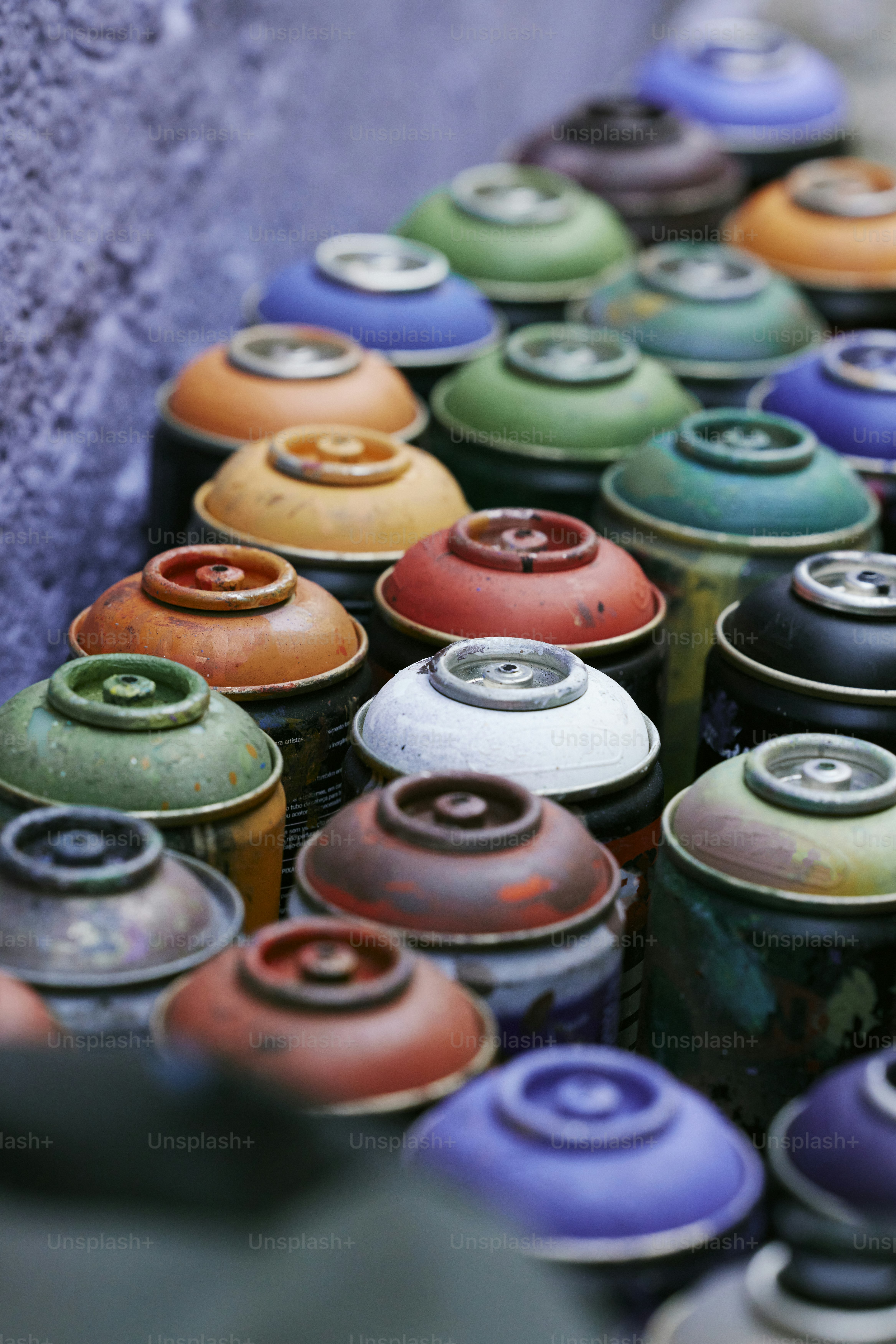 a group of colorful cans sitting next to each other