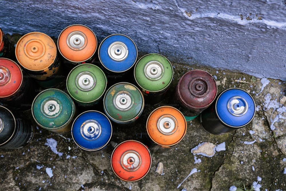 a bunch of cans that are sitting on the ground
